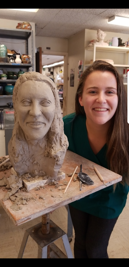 Emily sculpting a portrait bust