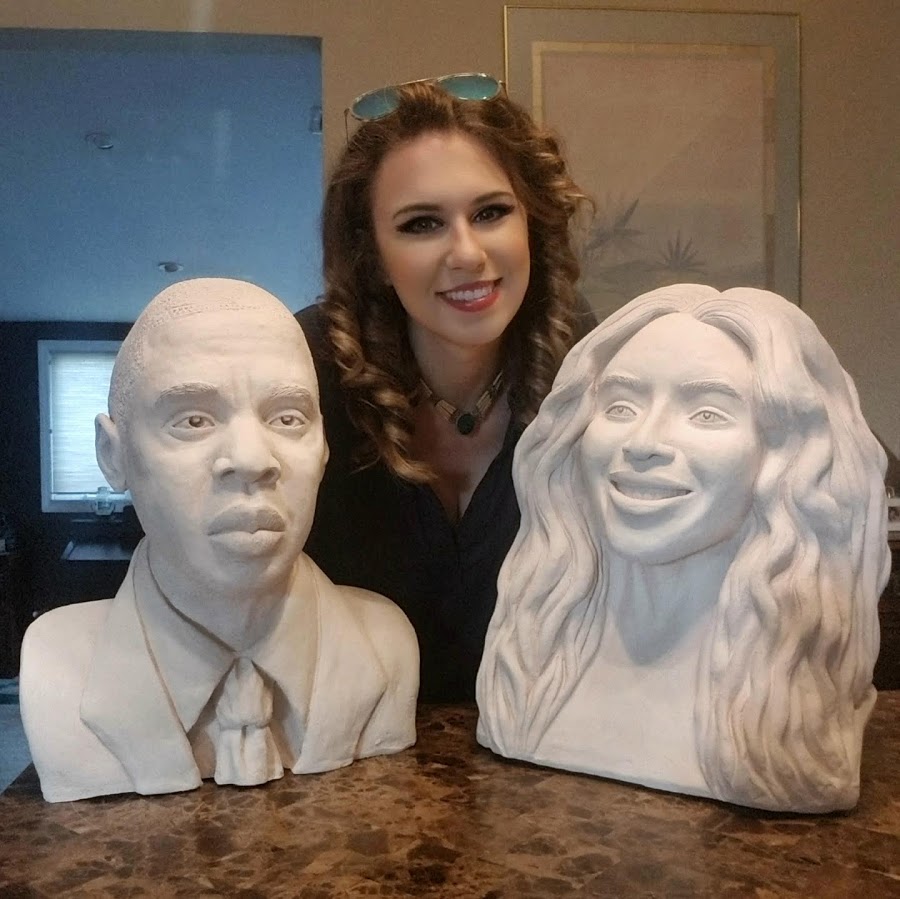 Emily with finished portrait busts
